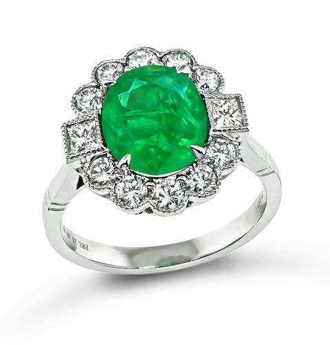 Oval Cut Emerald Round and Princess Cut Diamond Platinum Engagement Ring