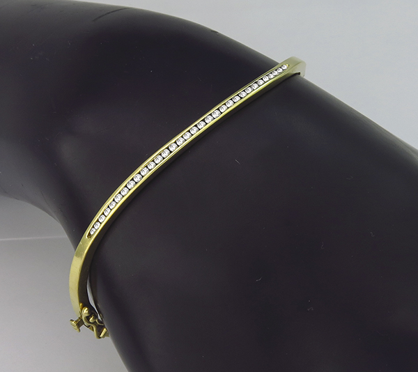 0.60ct diamond gold bangle photo 1